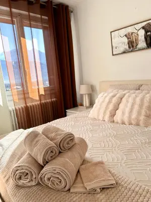 a bedroom with a bed with towels on it at Panorama MB 356 - Grande maison familiale vue exceptionnelle in Sallanches
