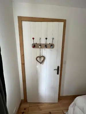 a door with four golf clubs and a heart on it at Refuge du Lyret Cozy Central Chamonix, Garden, Pkg in Chamonix-Mont-Blanc