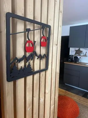 a room with a wooden wall with red mugs hanging on it at Refuge du Lyret Cozy Central Chamonix, Garden, Pkg in Chamonix-Mont-Blanc
