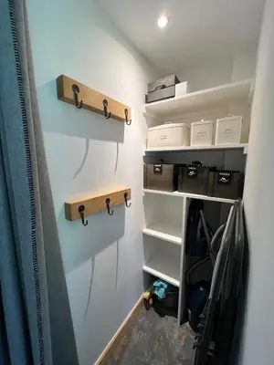 a room with shelves and hooks on the wall at Refuge du Lyret Cozy Central Chamonix, Garden, Pkg in Chamonix-Mont-Blanc