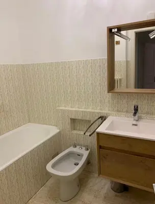 a bathroom with a sink and a toilet and a mirror at Superbe T3- Vue Mont-Blanc- Au pied du Brévent- Chamonix in Chamonix-Mont-Blanc