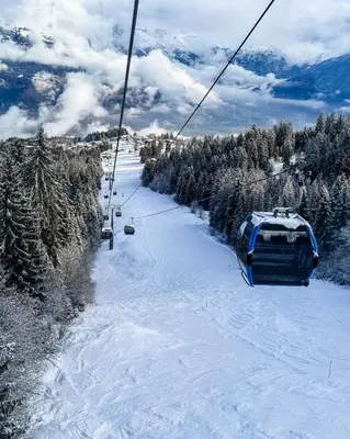 a ski lift going down a snow covered slope at Apartment near the slopes in Combloux in Combloux