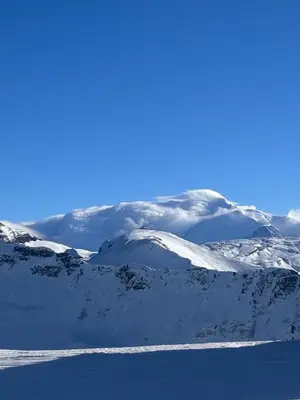 a snow covered mountain range with a blue sky at Appartement standing 3 chambres, Luxury 3-bedroom apartment 75m2 in Arâches-la-Frasse