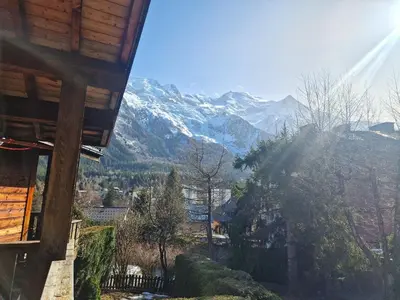 a view of a snowy mountain range from a house at Bel-Achat Vue MontBlanc in Chamonix-Mont-Blanc