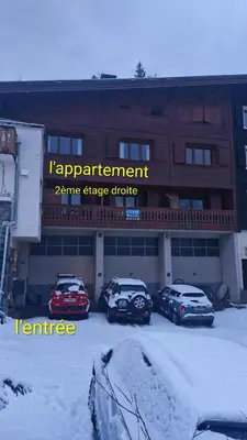three cars parked in a parking lot in front of a building at Cozy Bellevue - outdoor, skiing in Les Houches in Les Houches
