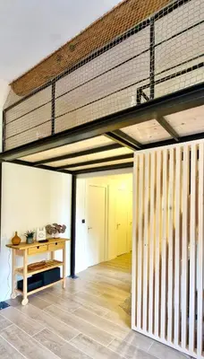 an empty room with a table and a ceiling at Cozy Bellevue - outdoor, skiing in Les Houches in Les Houches
