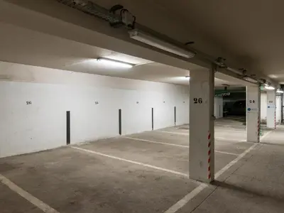 an empty parking lot in an empty parking garage at Vue montagne parking privé balcon in Chamonix-Mont-Blanc