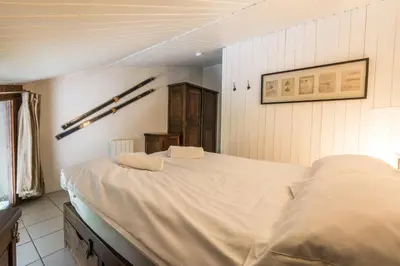 a bedroom with a large bed in a room at Apartment Les Avouilles Close to Chamonix Mont Blanc in Chamonix-Mont-Blanc
