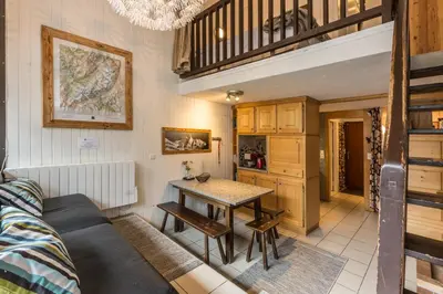 a living room with a couch and a table at Apartment Les Avouilles Close to Chamonix Mont Blanc in Chamonix-Mont-Blanc
