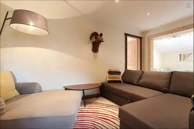 a living room with a couch and a table at Chamonix Apartment in Chamonix-Mont-Blanc