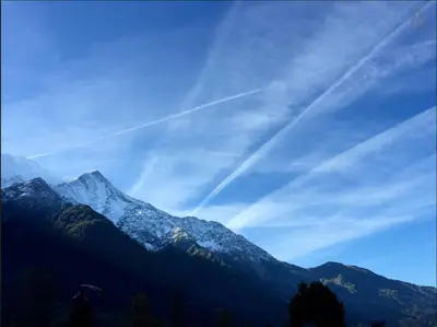 a view of a snow covered mountain in the sky at Chamonix Apartment in Chamonix-Mont-Blanc