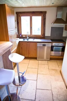 a kitchen with a sink and a stove at Chamonix Apartment in Chamonix-Mont-Blanc
