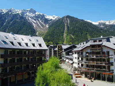 a group of buildings in front of a mountain at Studio Gentiane-5 by Interhome in Chamonix-Mont-Blanc