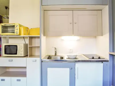 a small kitchen with a sink and a microwave at Studio Gentiane-5 by Interhome in Chamonix-Mont-Blanc