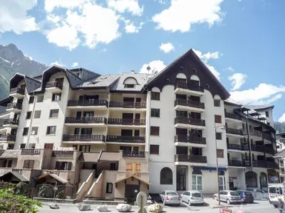 a large apartment building with a roof at Studio Gentiane-5 by Interhome in Chamonix-Mont-Blanc