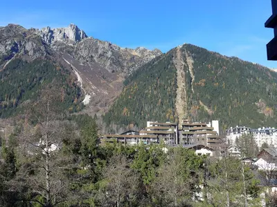 a large building in front of a mountain at Studio La Forclaz-6 by Interhome in Chamonix-Mont-Blanc