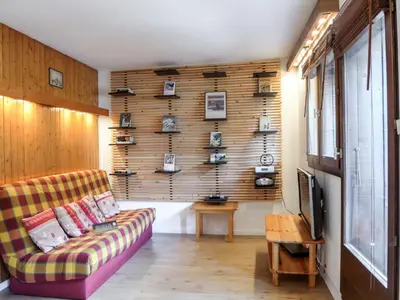 a living room with a couch in a room at Studio Champraz-14 by Interhome in Chamonix-Mont-Blanc