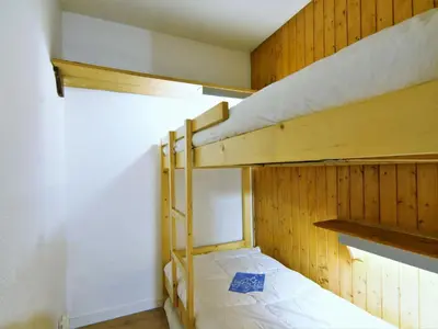 a kitchen with yellow tile on the wall at Studio Champraz-14 by Interhome in Chamonix-Mont-Blanc