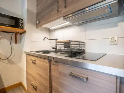 a kitchen with a sink and a counter top at Apartment Clos des Outannes-1 by Interhome in Chamonix-Mont-Blanc