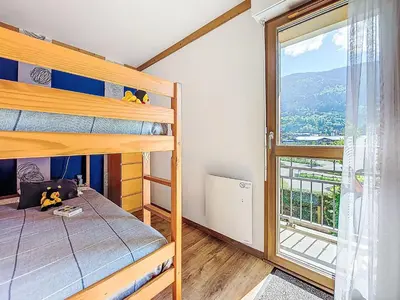 a table with bowls on it sitting on a balcony at Apartment Clos de la fontaine 2 by Interhome in Saint-Gervais-les-Bains