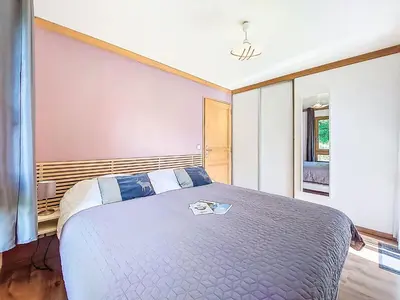 a bunk bed with a teddy bear sitting on top at Apartment Clos de la fontaine 2 by Interhome in Saint-Gervais-les-Bains