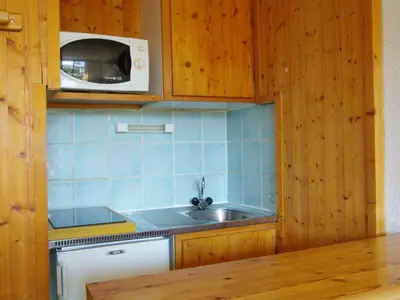 a kitchen with a sink and a microwave at Studio Le Chailloud-4 by Interhome in Chamonix-Mont-Blanc