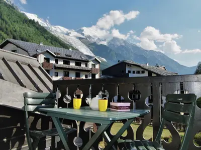 a bedroom with a bed with pink sheets and pillows at Studio Le Chailloud-4 by Interhome in Chamonix-Mont-Blanc