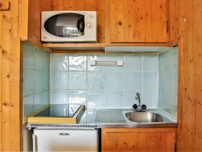a bathroom with a white tub and a sink at Studio Le Chailloud-4 by Interhome in Chamonix-Mont-Blanc
