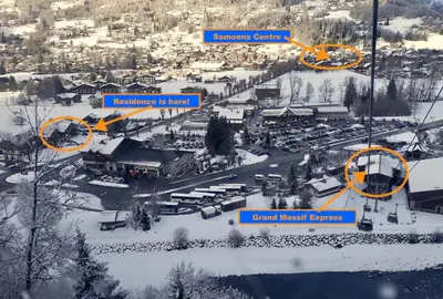 an aerial view of a parking lot in the snow at Residence Le Pas Au Loup in Samoëns