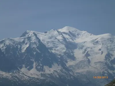 a mountain covered in snow with a blue sky at Aiguille du Midi - Le Chamo'nid in Chamonix-Mont-Blanc