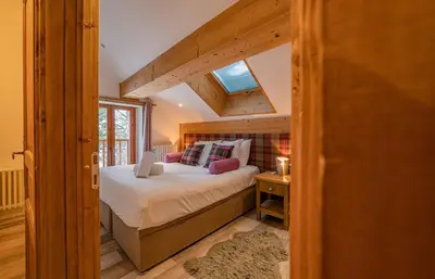 a bedroom with a large bed in a house at Loft Apartment High Rimaye - Mont Blanc Views, Close to Brevent in Chamonix-Mont-Blanc