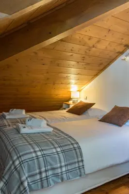 a bedroom with two beds in a attic at Villa Vallet Apartment - Chamonix All Year in Chamonix-Mont-Blanc