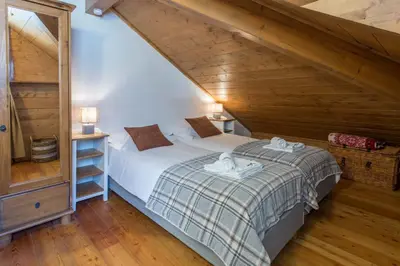 a bedroom with a bed in a attic at Villa Vallet Apartment - Chamonix All Year in Chamonix-Mont-Blanc