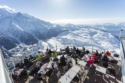 a group of people sitting on the top of a mountain at La Belle Epoque - Chamonix All Year in Chamonix-Mont-Blanc