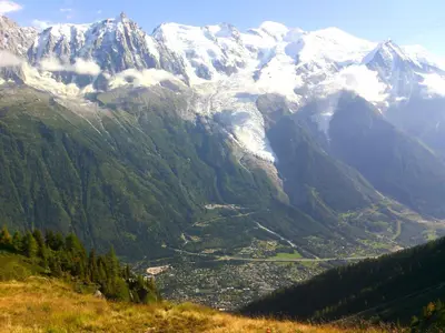 a view of a mountain valley with snow covered mountains at Hotel Du Clocher in Chamonix-Mont-Blanc