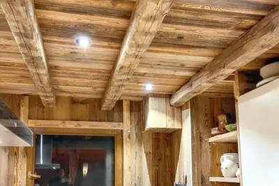 a room with wooden ceilings in a house at Chalet spacieux à Cordon 180 m² avec vue montagne in Cordon