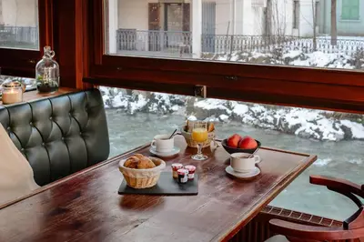 a room with wooden doors and wooden floors at Hôtel Vallée Blanche in Chamonix-Mont-Blanc