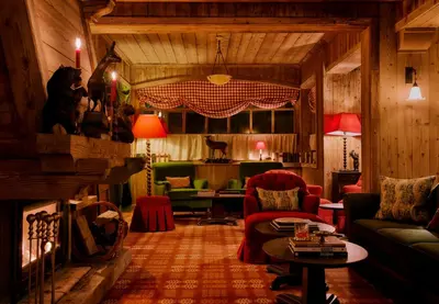 a living room with a couch and chairs and a table at Hôtel Saint-Georges Relais & Châteaux in Megève