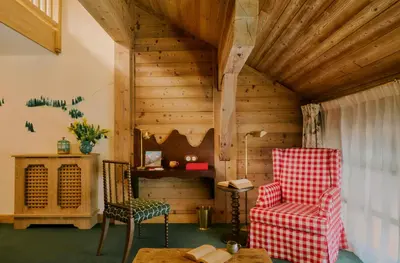 a room with two chairs and a table at Hôtel Saint-Georges Relais & Châteaux in Megève