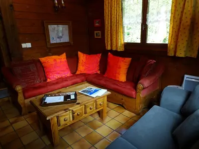 a living room with two couches and a coffee table at Chalet des Glaciers in Chamonix-Mont-Blanc