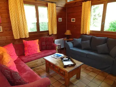 a living room with couches and a coffee table at Chalet des Glaciers in Chamonix-Mont-Blanc