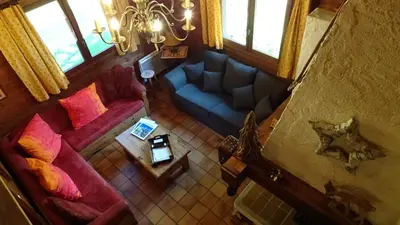 an overhead view of a living room with a blue couch at Chalet des Glaciers in Chamonix-Mont-Blanc