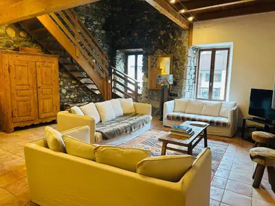 an entrance to a stone building with a doorway at Maison du Bourg in Samoëns
