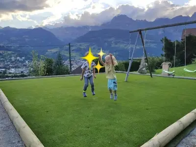 two children playing with a star on a soccer field at Chantemerle 1741, chambres d'hôtes à la montagne in Sallanches