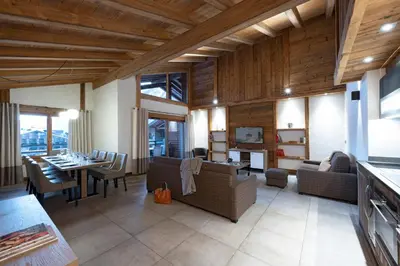 a bedroom with a large bed with a skylight at MGM Hôtels & Résidences - Résidence Le Cristal de Jade in Chamonix-Mont-Blanc