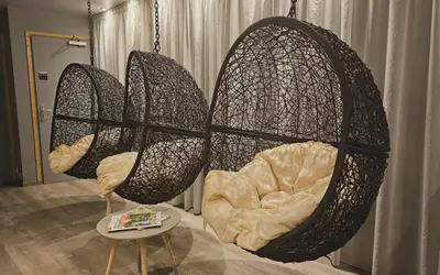 three chairs in a room with a table at La Croix de Savoie & Spa in Les Carroz d'Araches