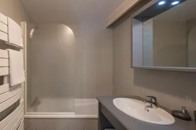 a bathroom with a sink and a shower at Chalet Hideaway 2 in Chamonix-Mont-Blanc
