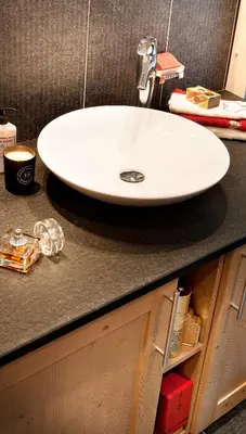 a white sink sitting on a bathroom counter at CGH Résidence Boutique Les Chalets de Léana in Les Carroz d'Araches