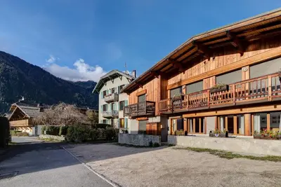 a large wooden building with a balcony on it at APARTMENT BIOLAY - Alpes Travel - Central Chamonix - Sleeps 6 in Chamonix-Mont-Blanc