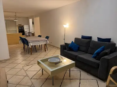 a living room with a couch and a table at Appartement CITY CENTER-SALLANCHES in Sallanches